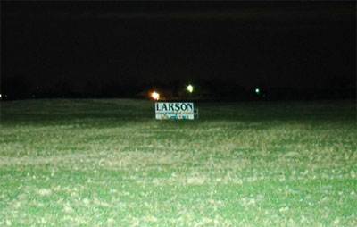 This image shows a close up picture of the `Larson` sign, notice that the beam output still reaches farther than the sign positioned 750 feet away from the unit.